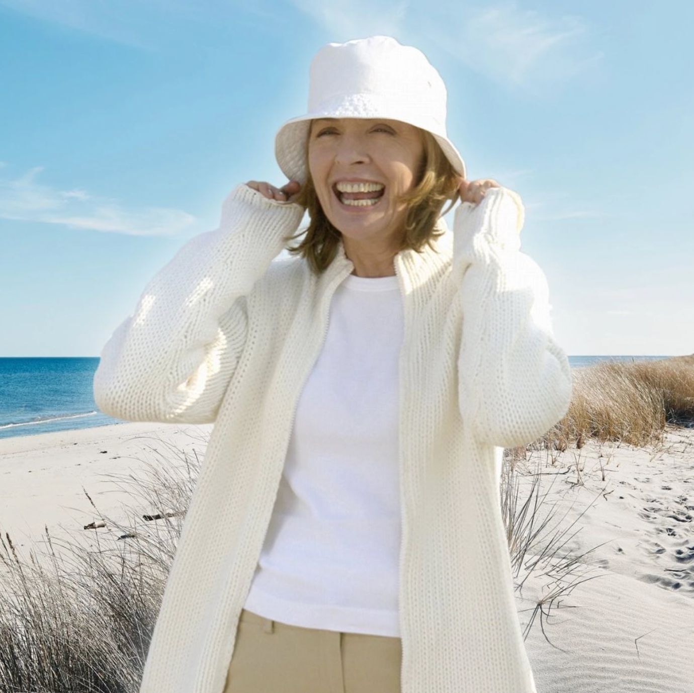 Diane Keaton in white knit sweater and bucket hat