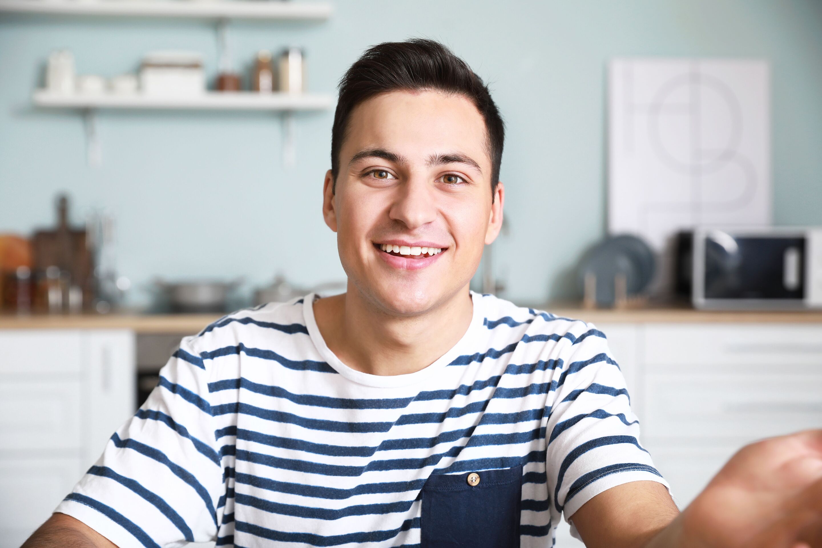 Man checking himself on a video call.