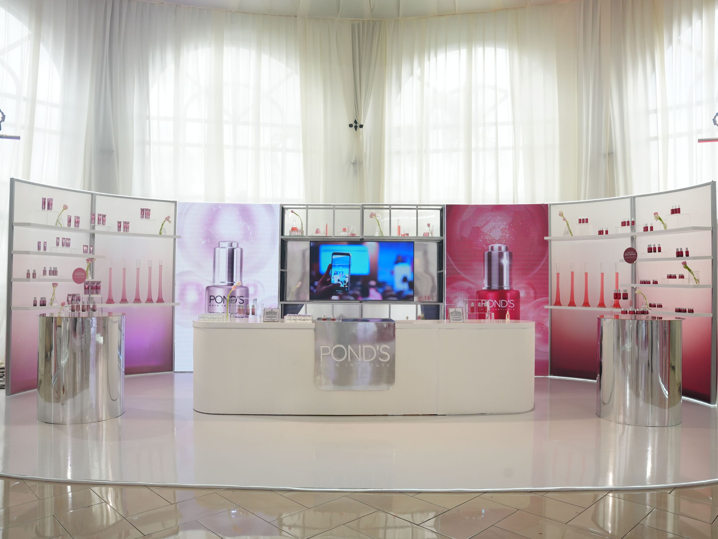 A display of POND’S skincare products at an event.