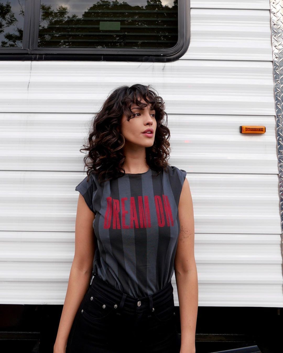 Eiza Gonzalez owns her curly curtain bangs in I Care a Lot.