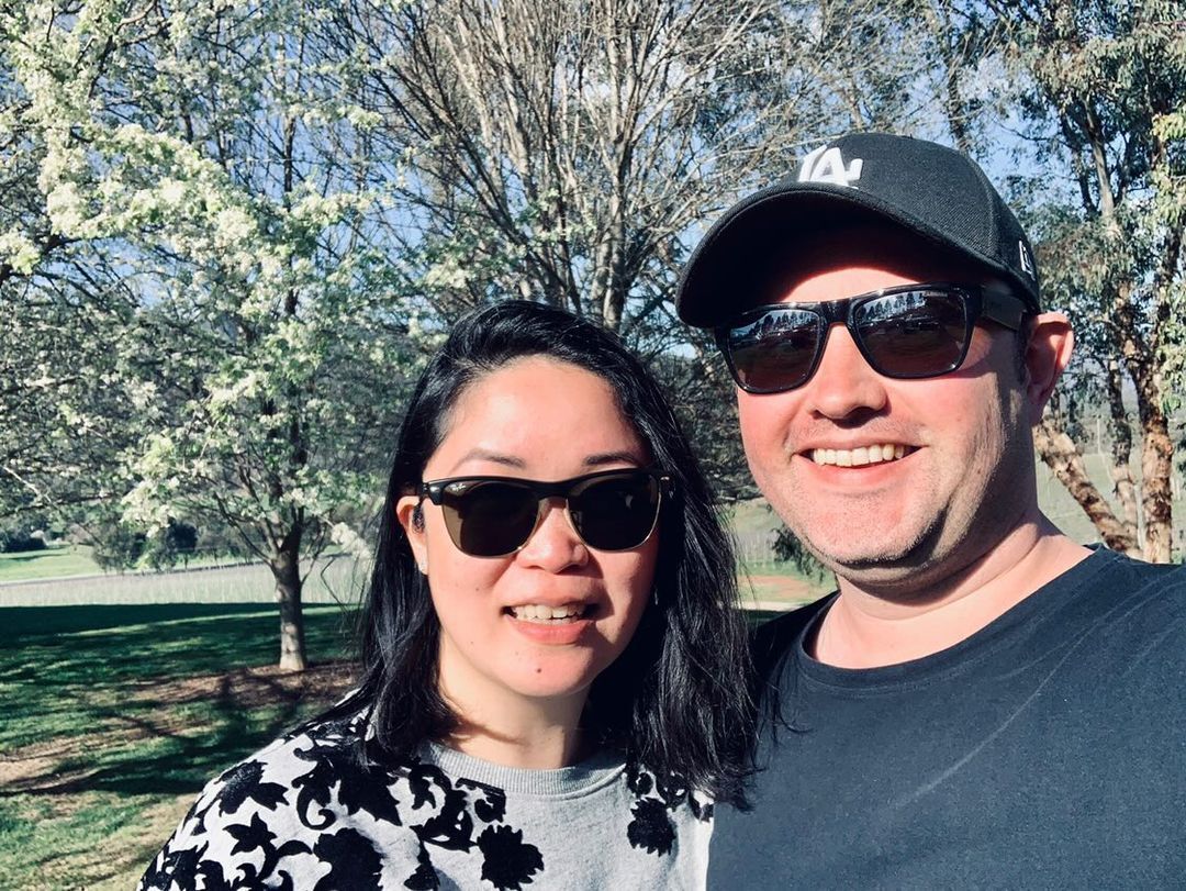 Mixed race couple posing outdoors