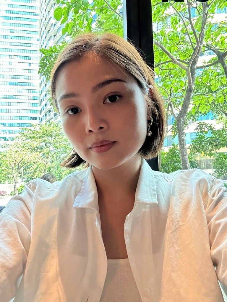 A beautiful woman with bob hair posing in front of the camera.