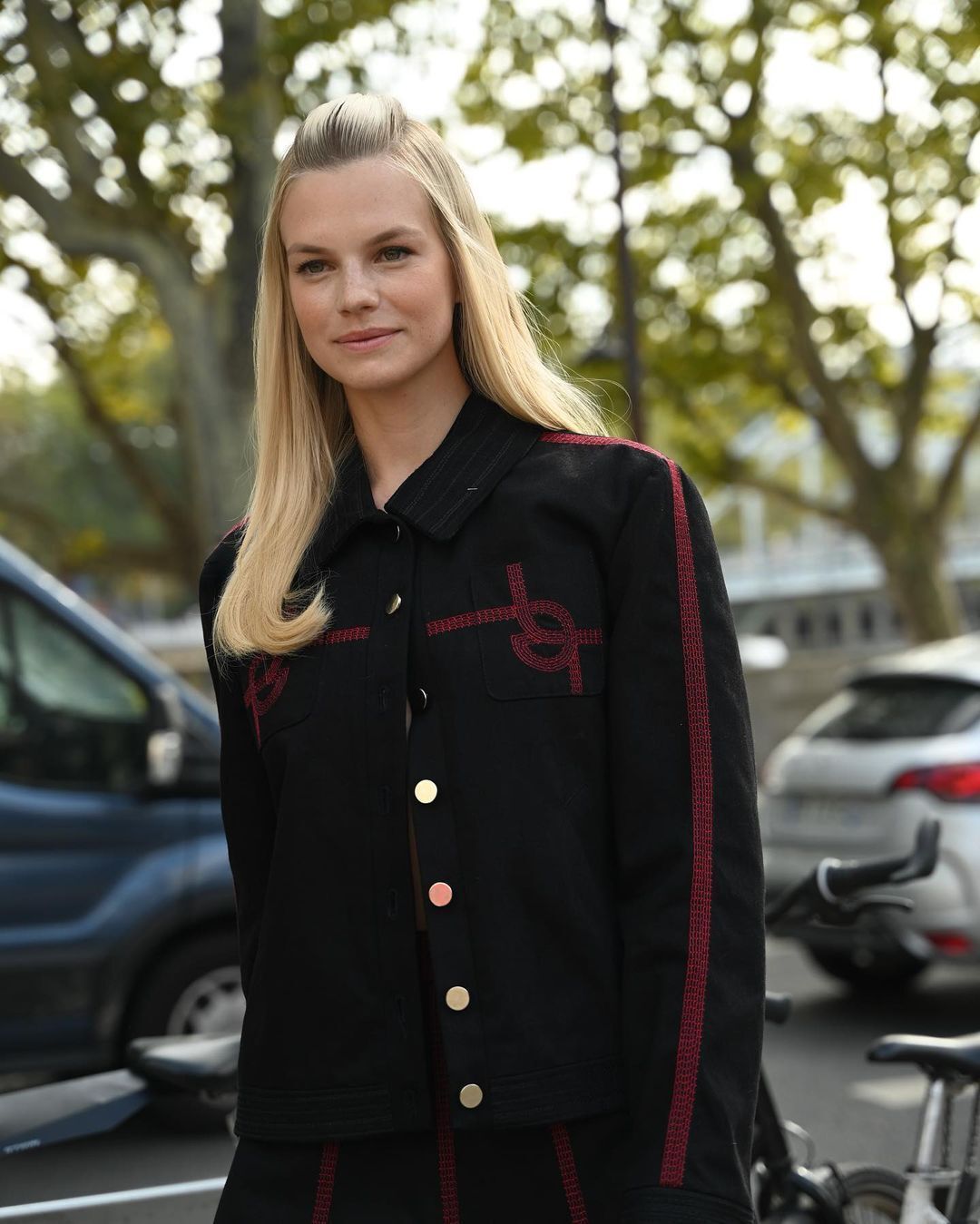 A portrait of Nadine Leopold with sleek bumpit hair.