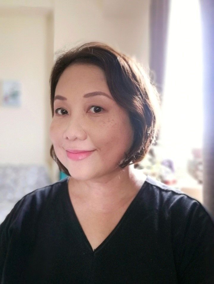 Asian woman with short hair and freckle