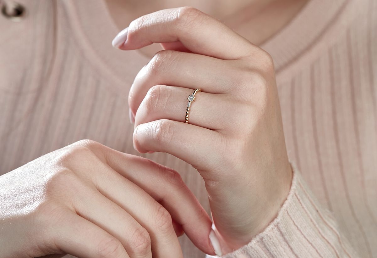 Woman wearing ring. 