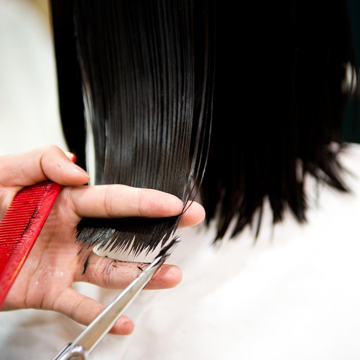 Asian woman getting a trim