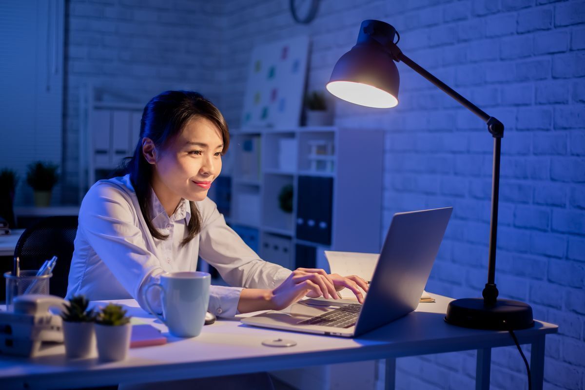 Asian woman working at night.