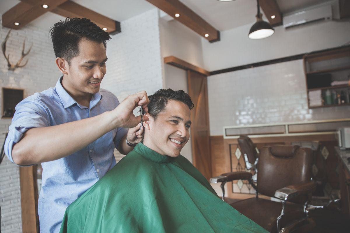 Asian man in barbershop 