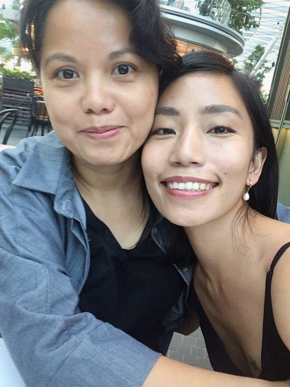 Lesbian couple smiling at the camera