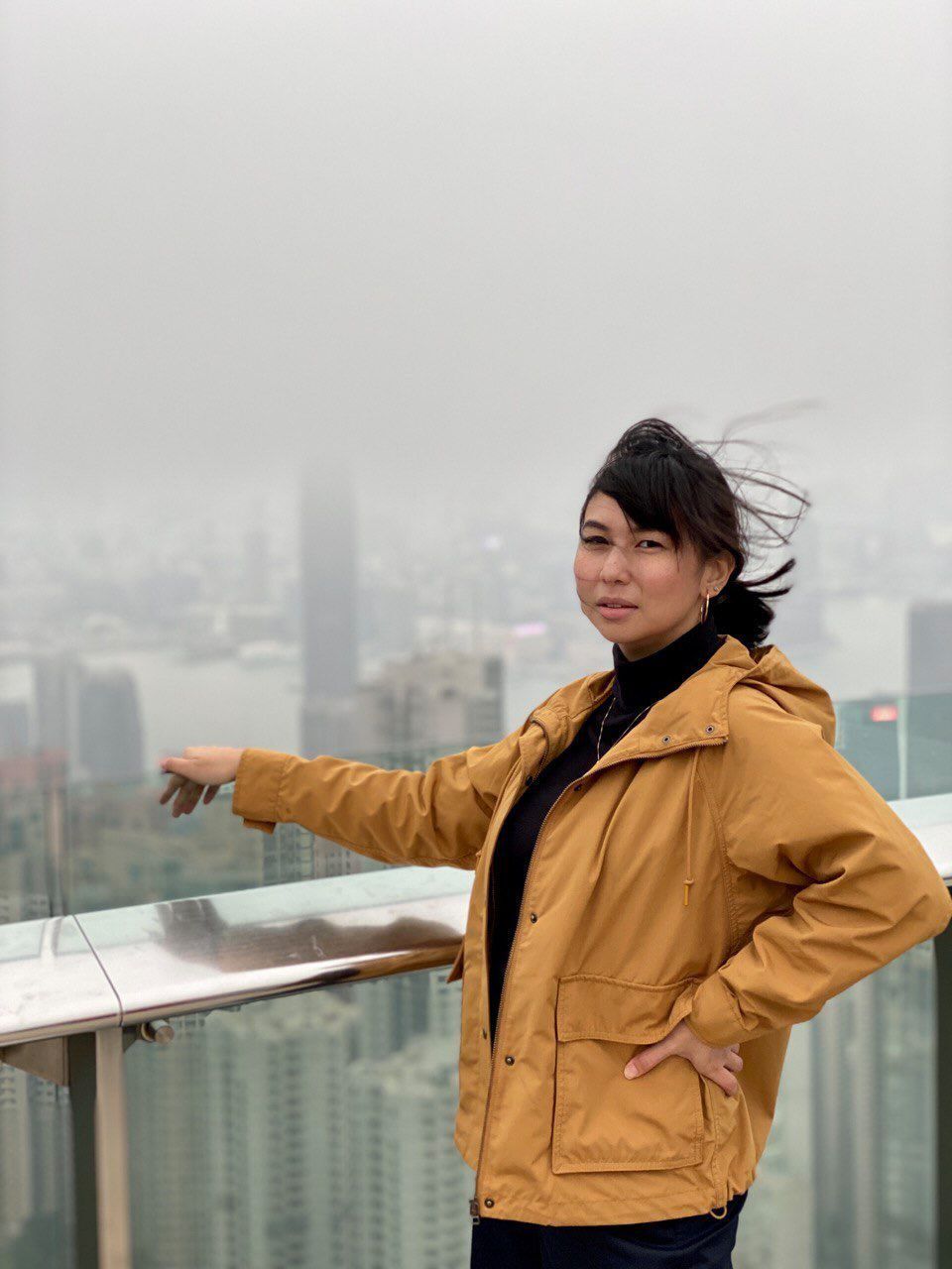 Asian woman with windblown hair