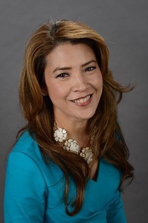 Closeup Asian woman with long hair wearing a blue top