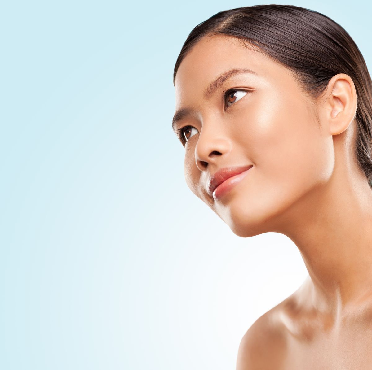 Brown skinned woman with glowing skin