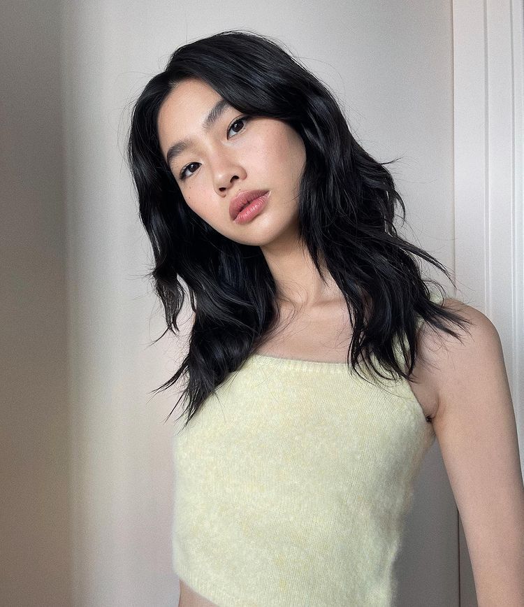 Fresh faced Asian woman with black hair