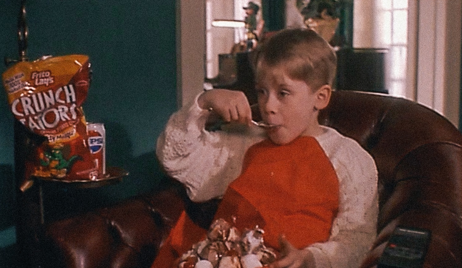 Scene from Home Alone where Kevin McCallister eats junk food.