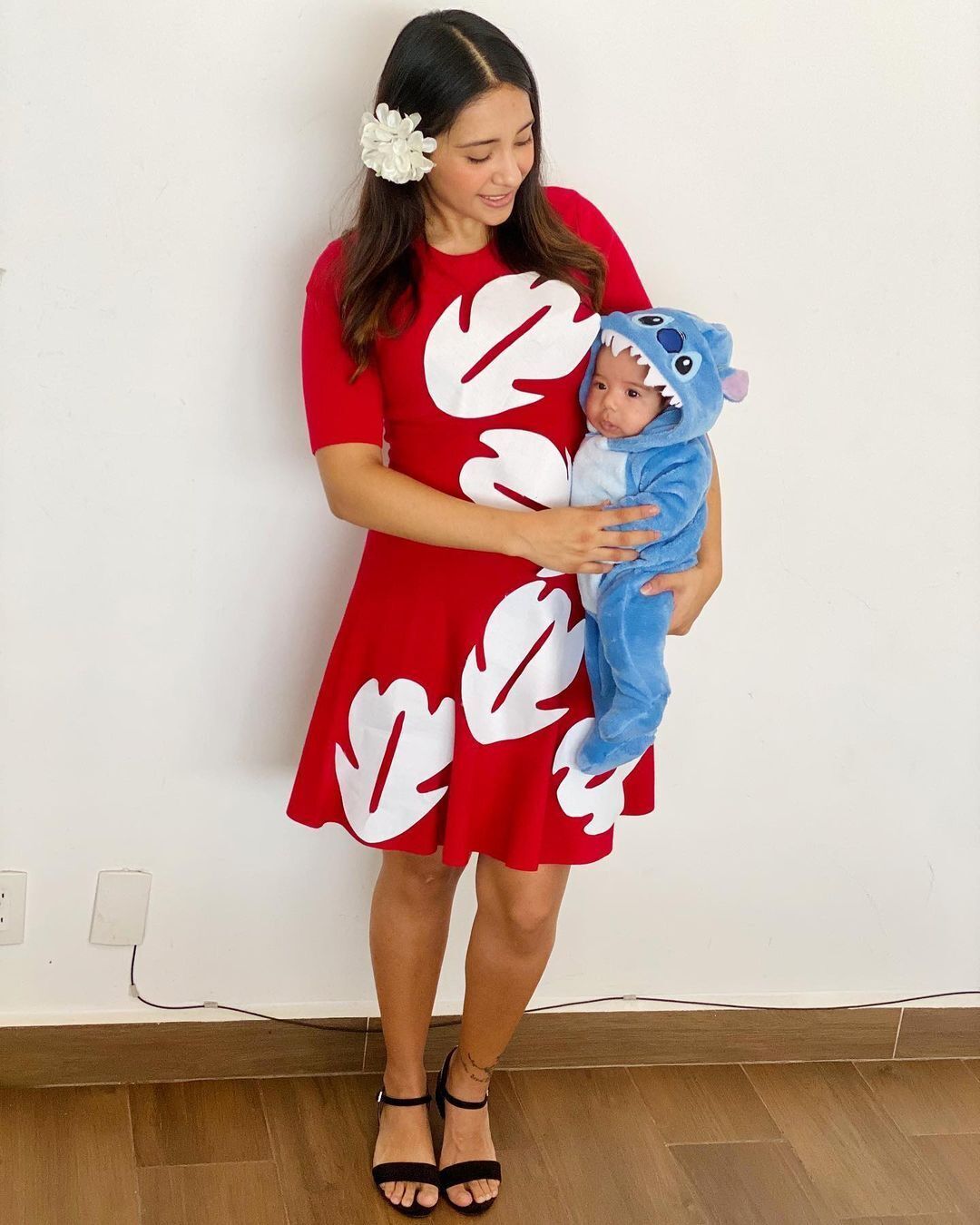Woman and baby dressing up as Lilo and Stitch.