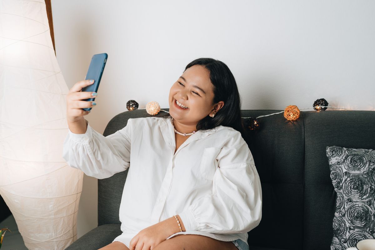 Filipino woman taking a selfie.