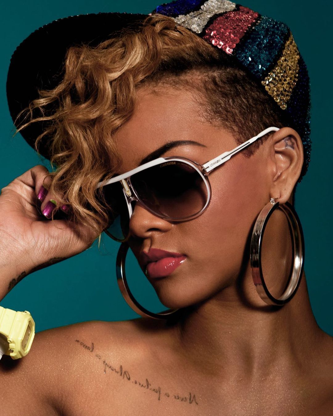 Rihanna with a blonde mohawk.