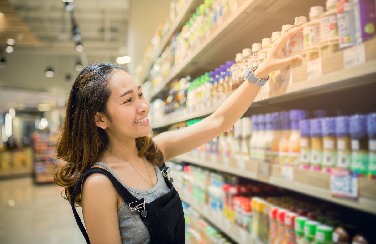 Asian woman shopping for skincare products