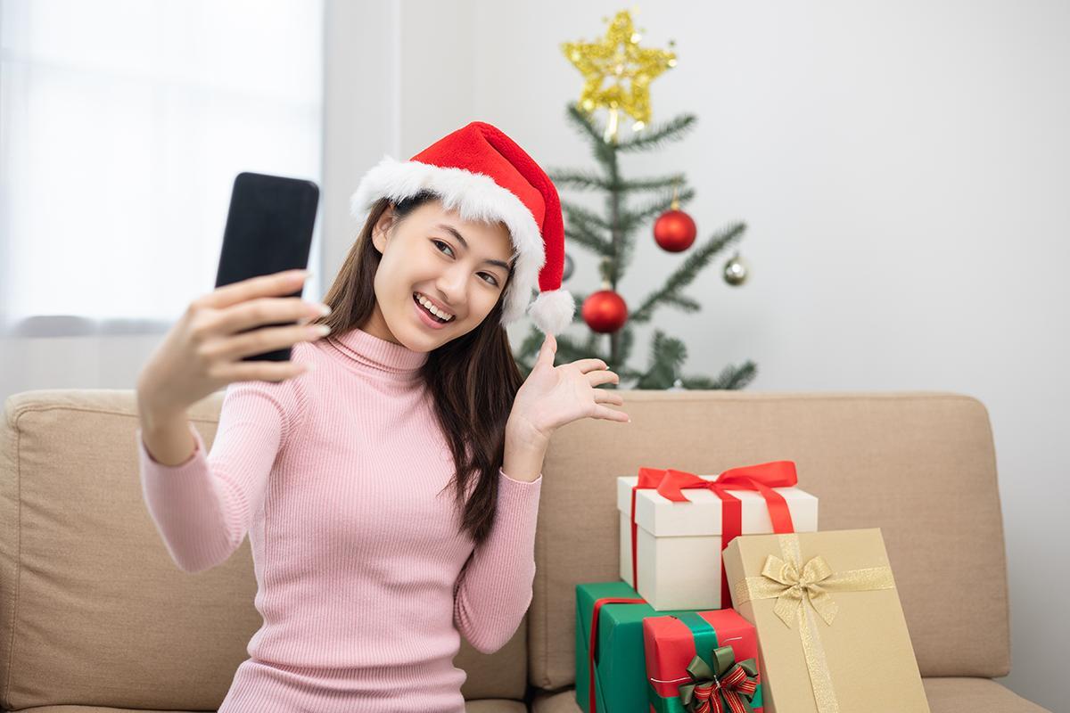Asian girl smiling at her phone