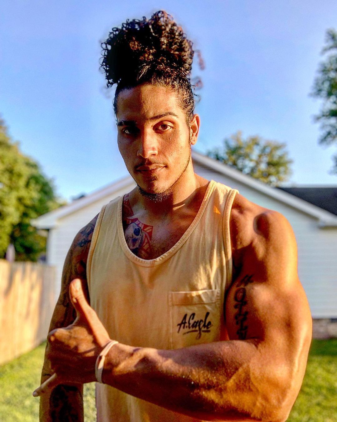 Man with pineapple curly hair.