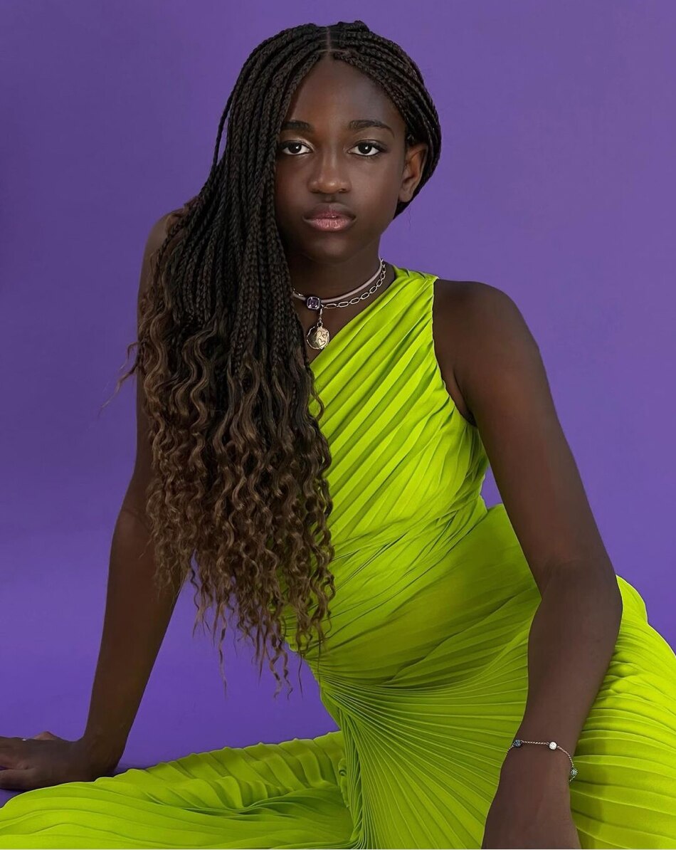  Image of an African American woman wearing a neon green dress.