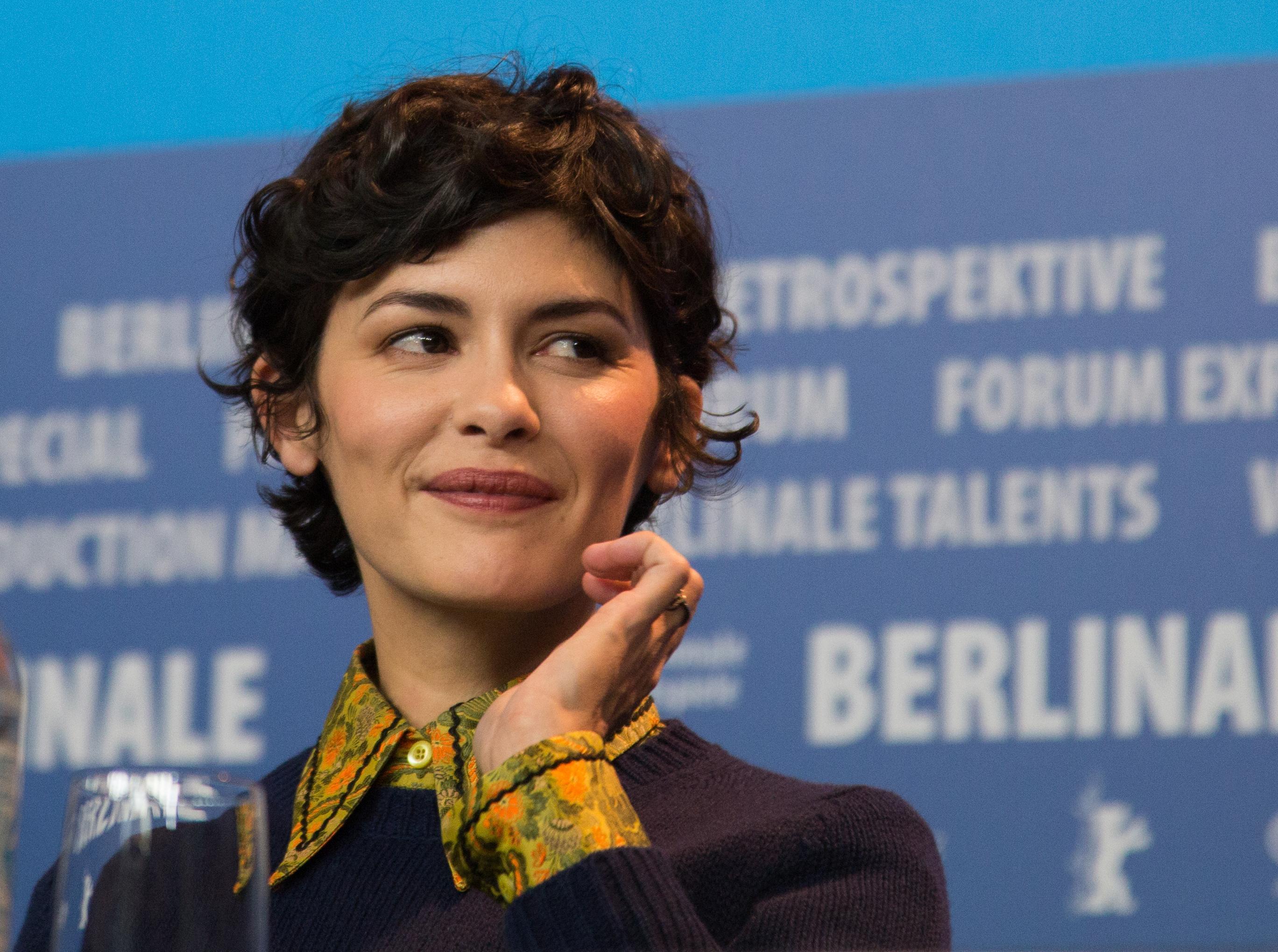 Woman with short, curly hair