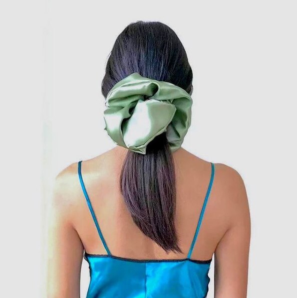a woman with a silk scrunchie