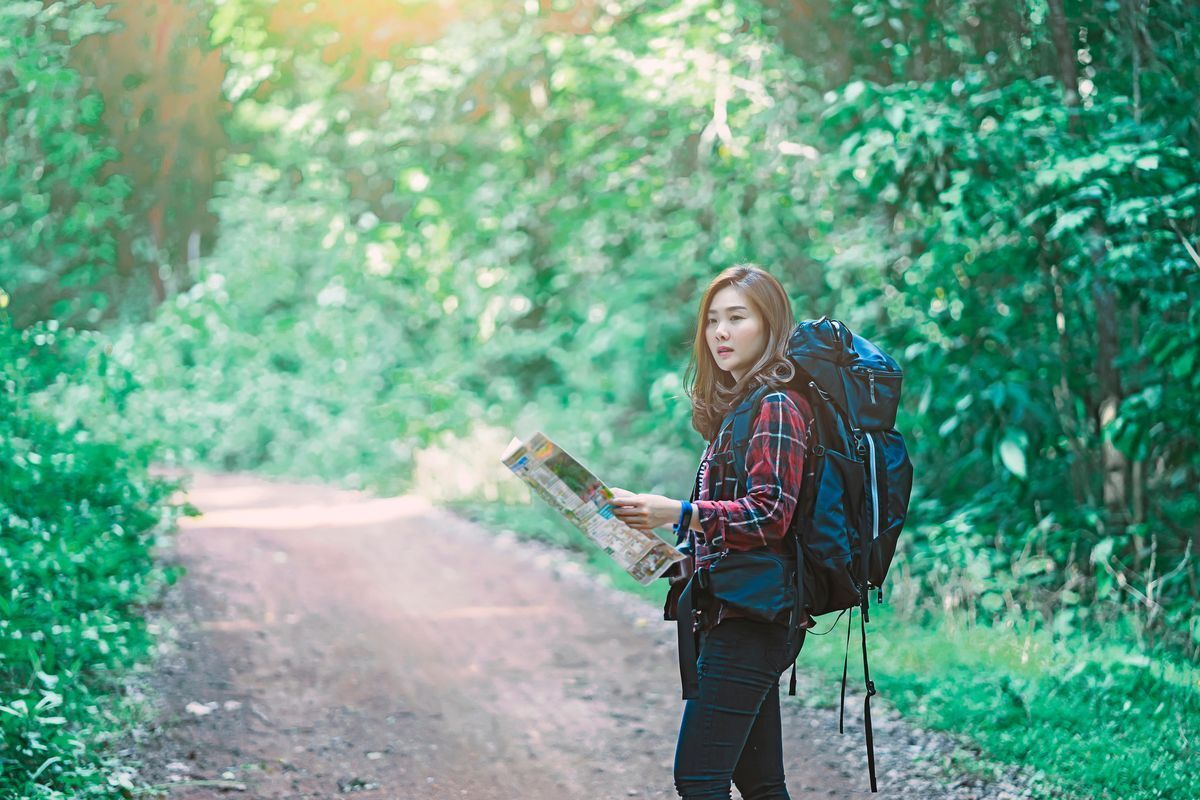 Asian woman lost in the woods