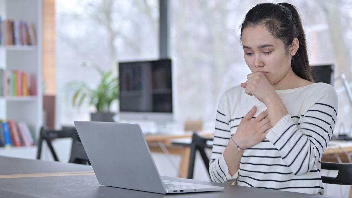 Asian woman coughing