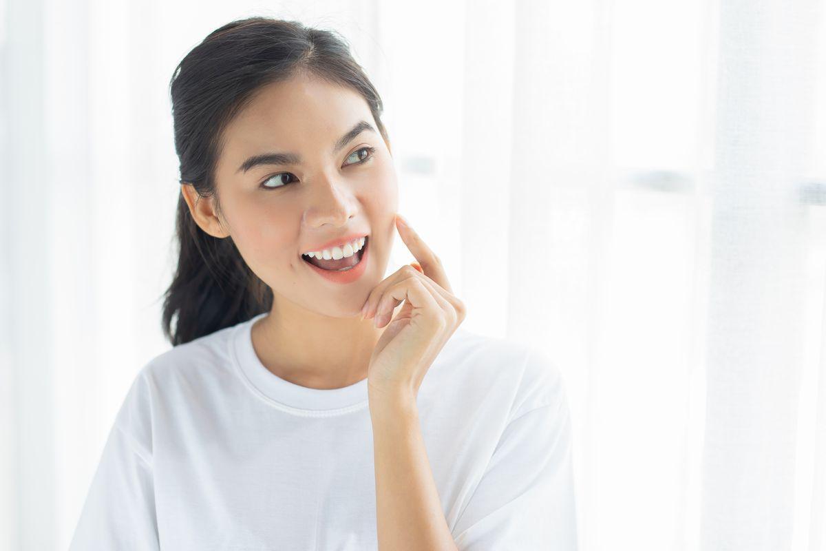 Asian woman with nice teeth smiling