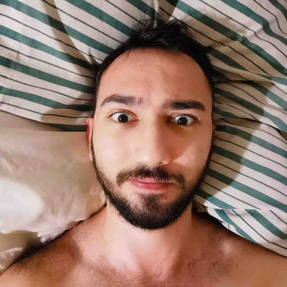 A selfie of a bearded young man