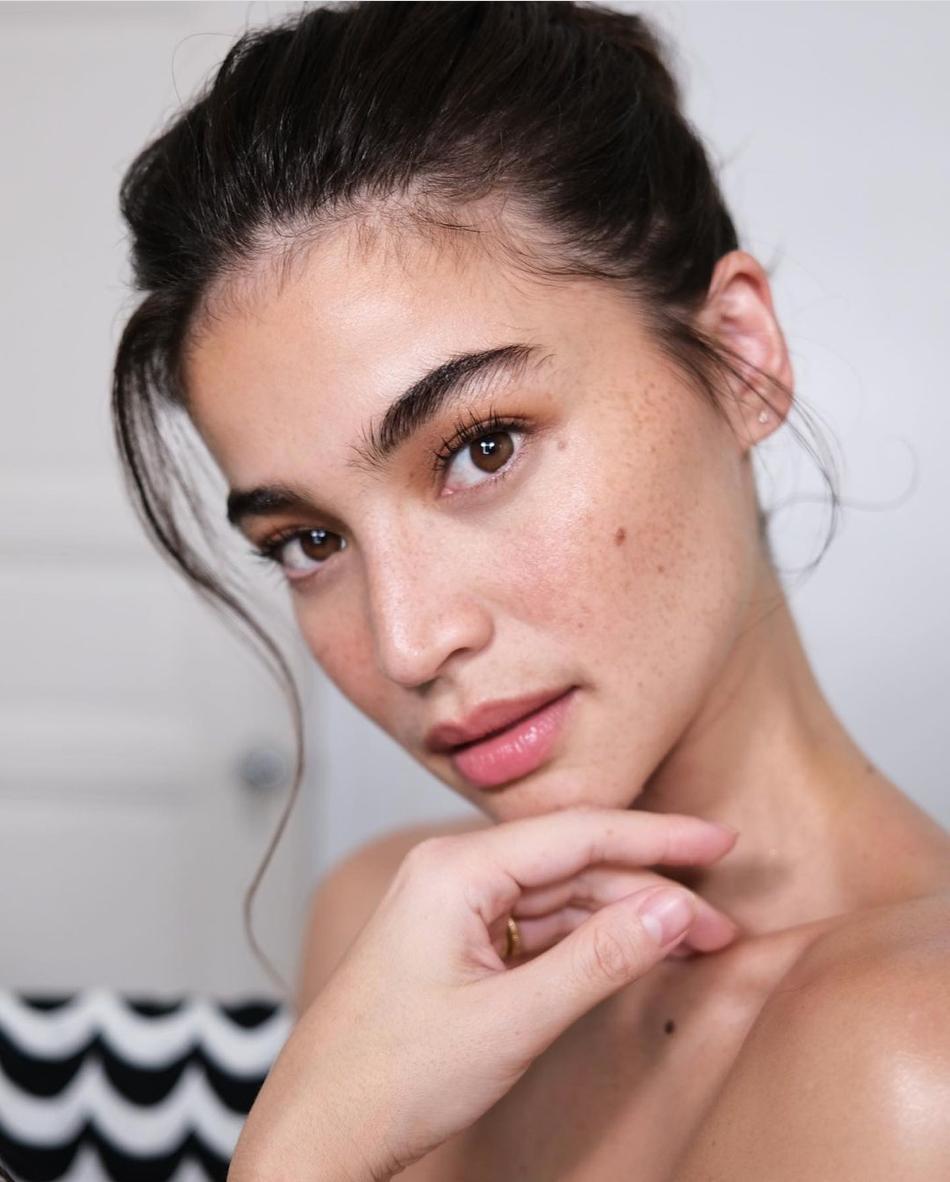 Asian woman in a loose topknot