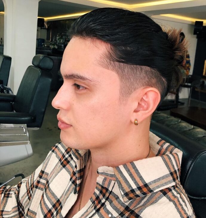 Man wearing hair gel.