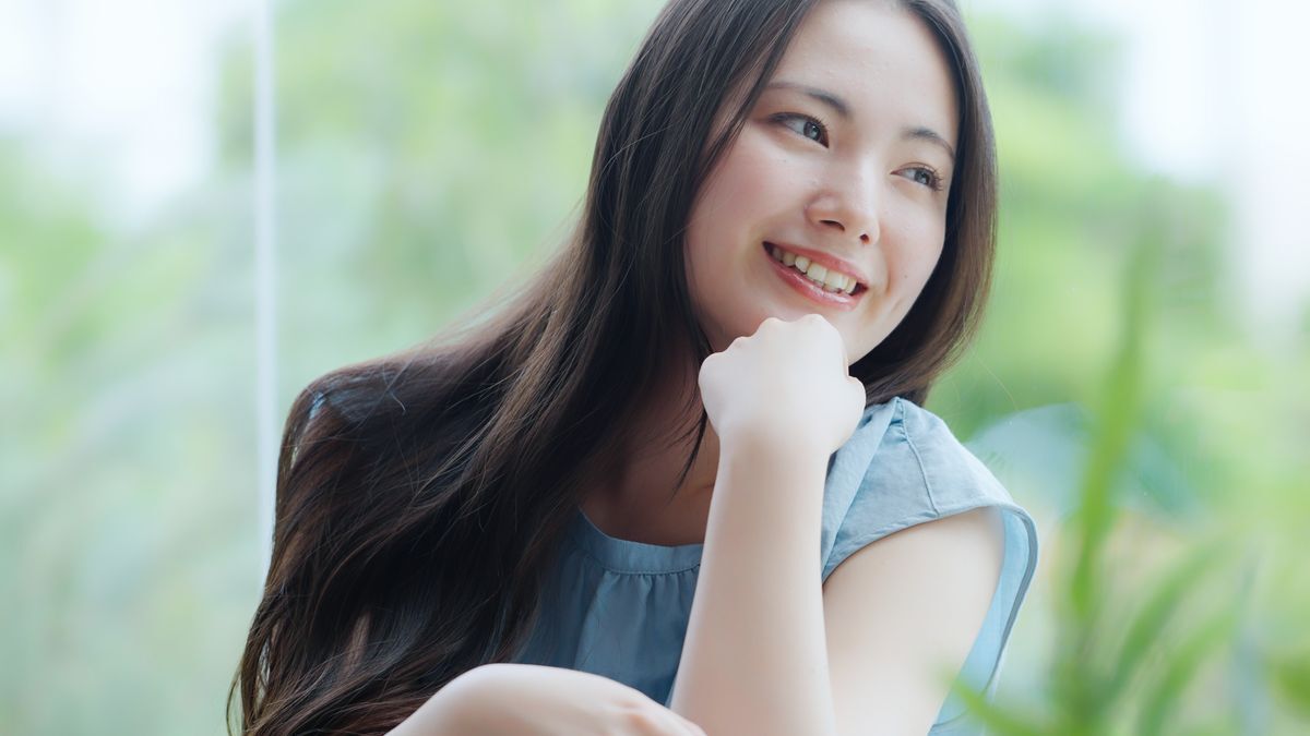 Smiling woman with smooth hair 