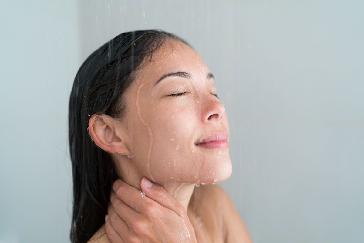 Woman rinsing hair in the shower