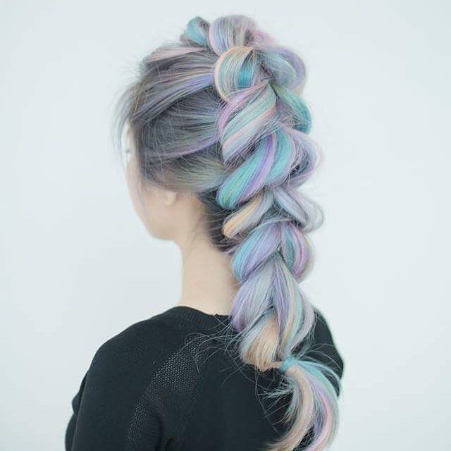 A portrait of woman with faux mohawk.