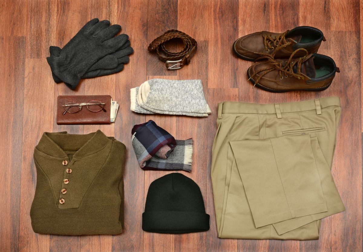 Flat lay of different articles of men’s clothing.
