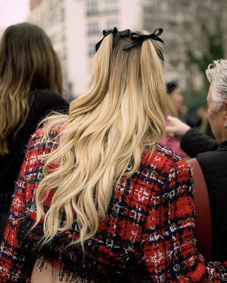 A portrait of Sydney Sweeney’s back with cascading blonde waves.