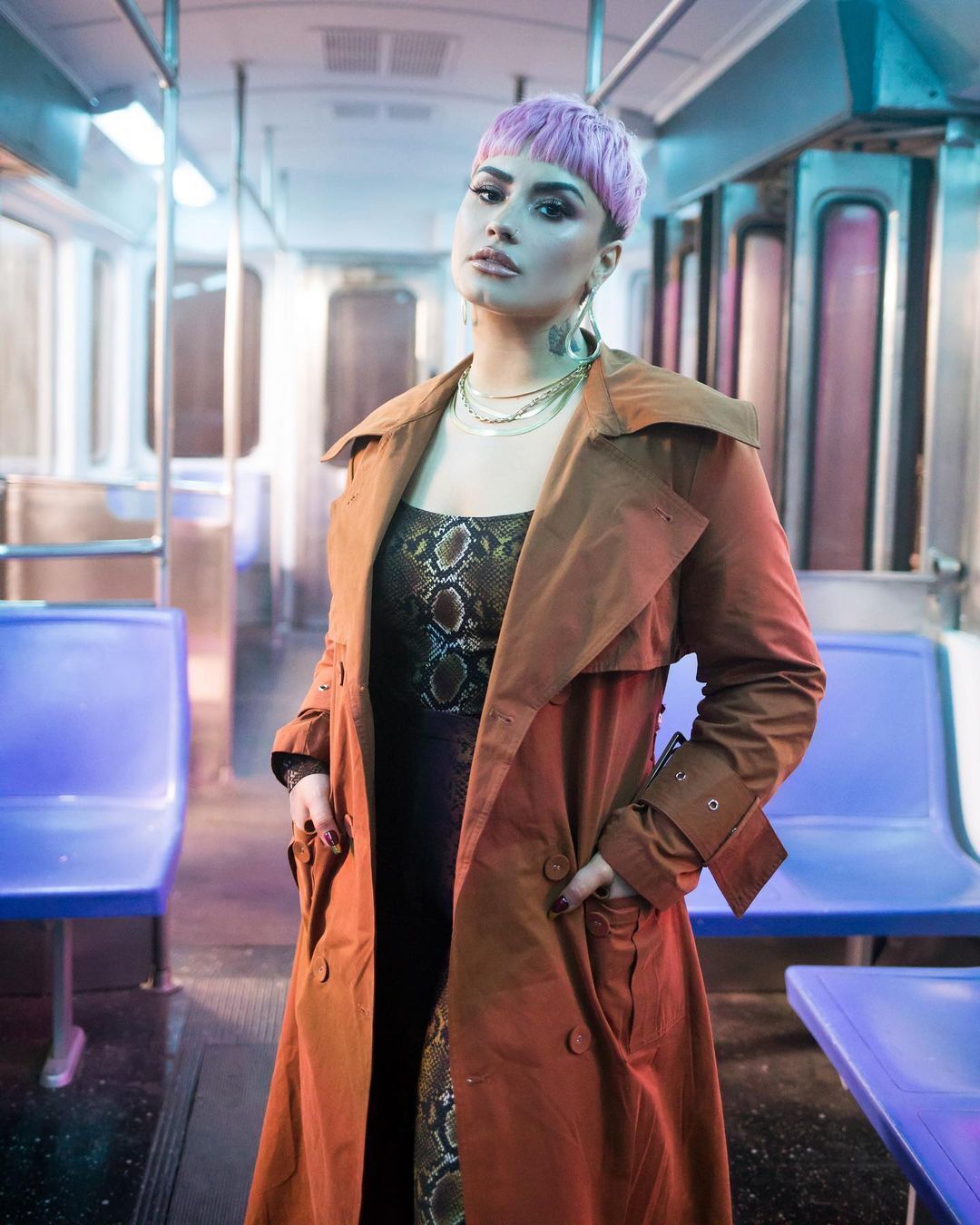 Singer Demi Lovato with a pink bowl cut