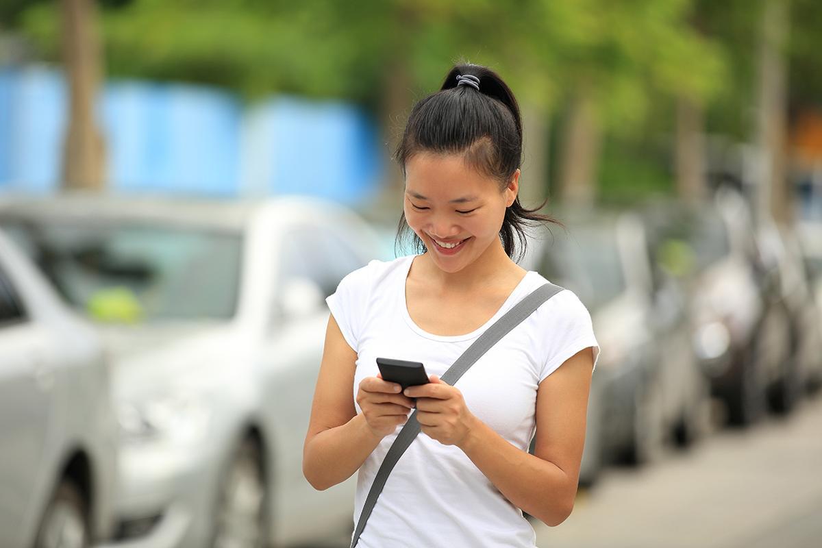 Woman in a ponytail using her phone