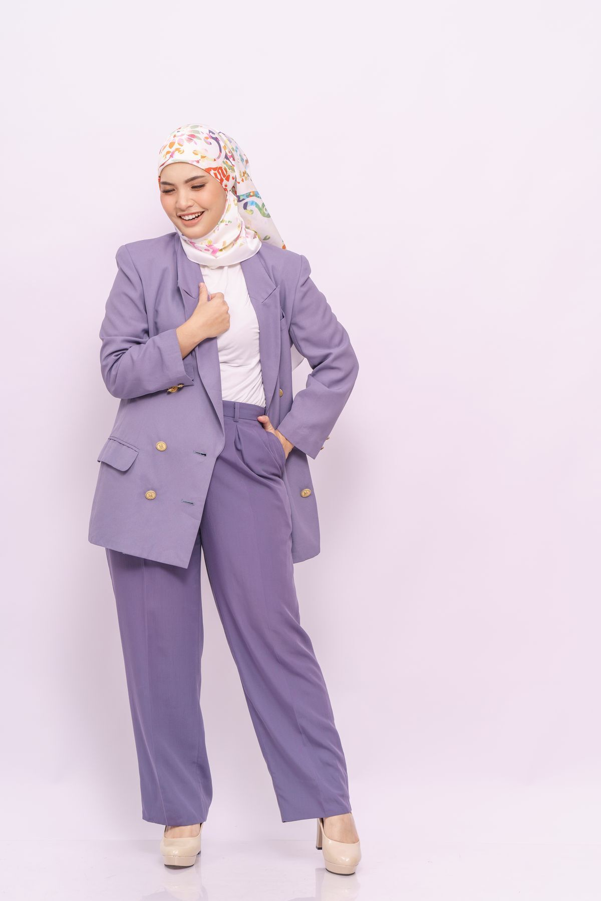 Asian woman showing off her work attire