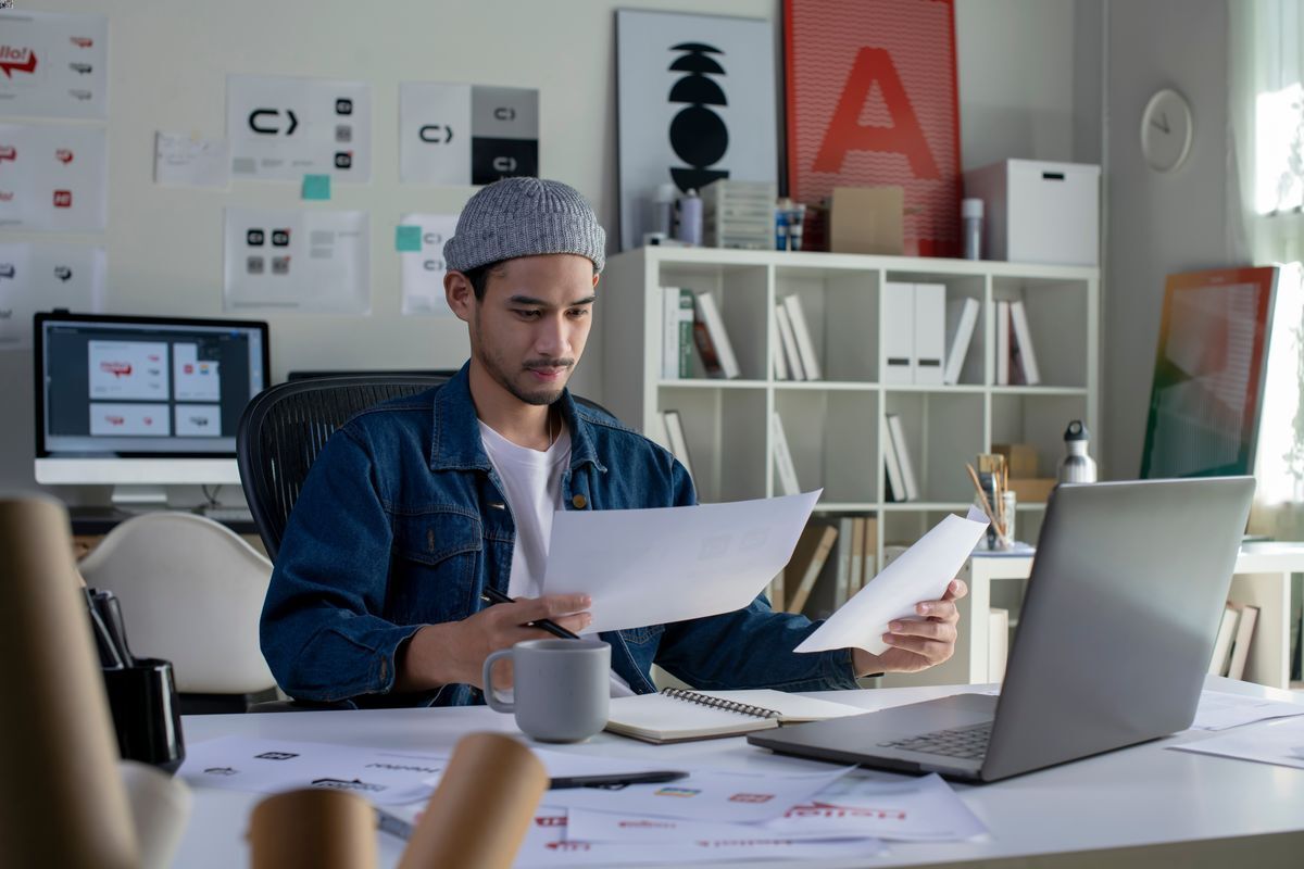 Asian guy at a creative office.
