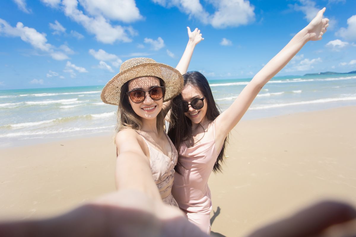 Asian women taking selfie