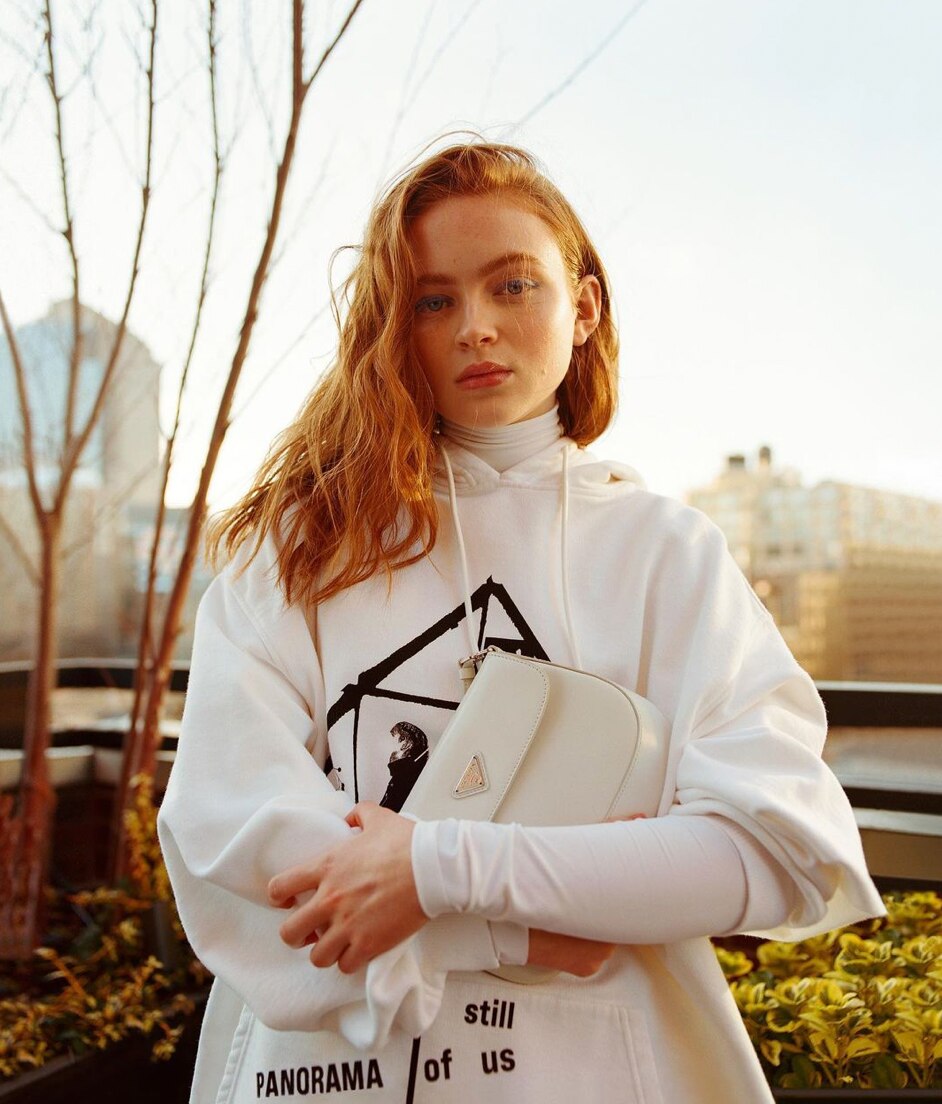 Redhead in a white sweater