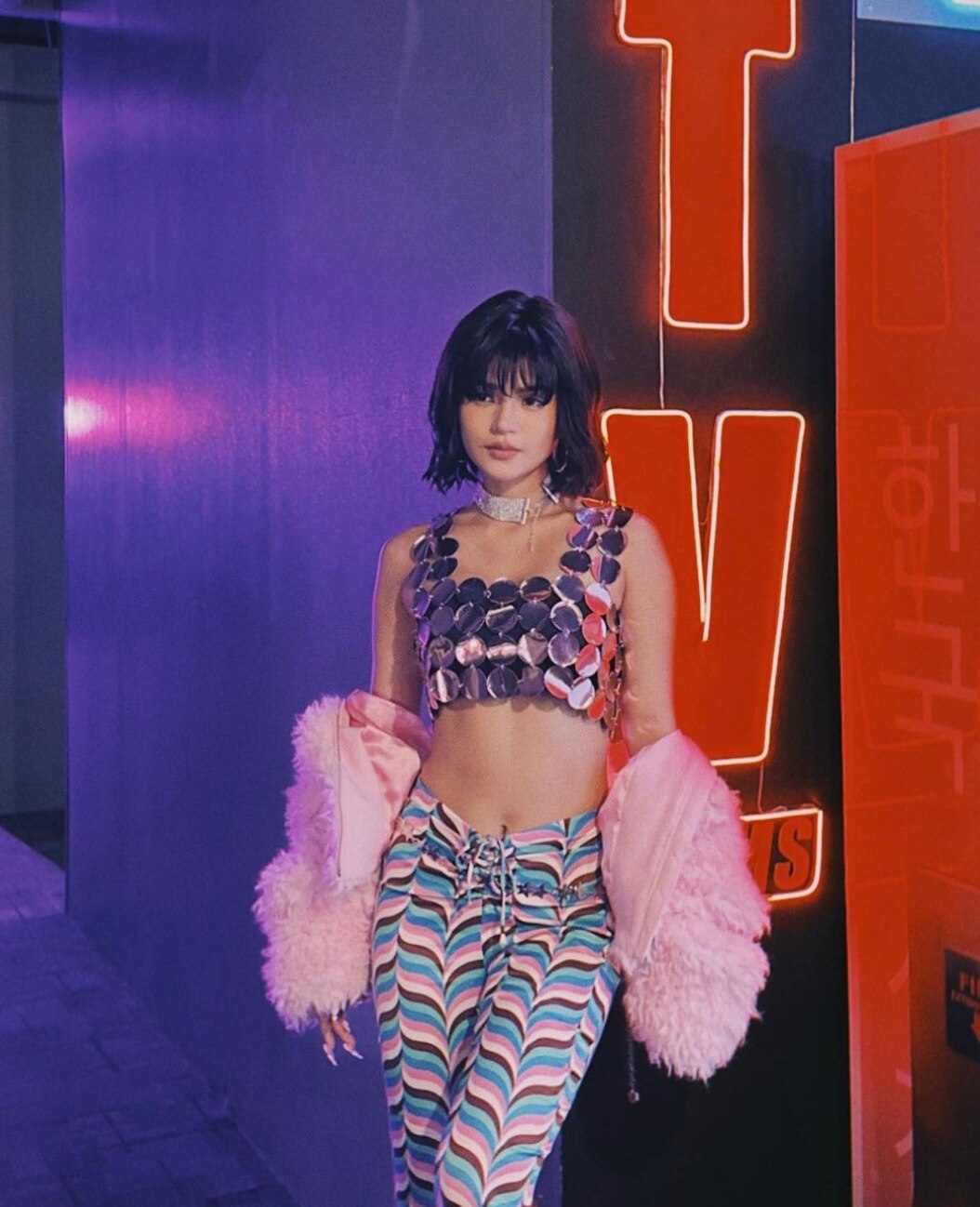 Maris Racal with short hair, wearing a sequined top and fluffy pink shrug.
