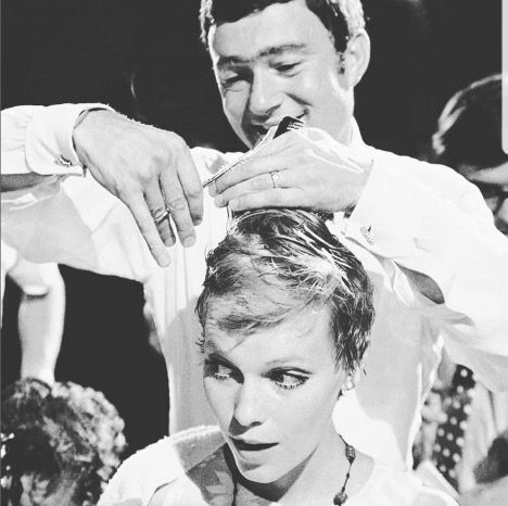 Famed hairstylist Vidal Sassoon trimming Mia Farrow's pixie cut for Rosemary's Baby