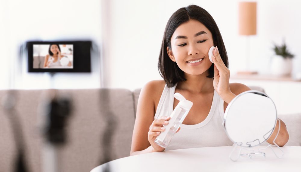 A woman applying chemical exfoliator.