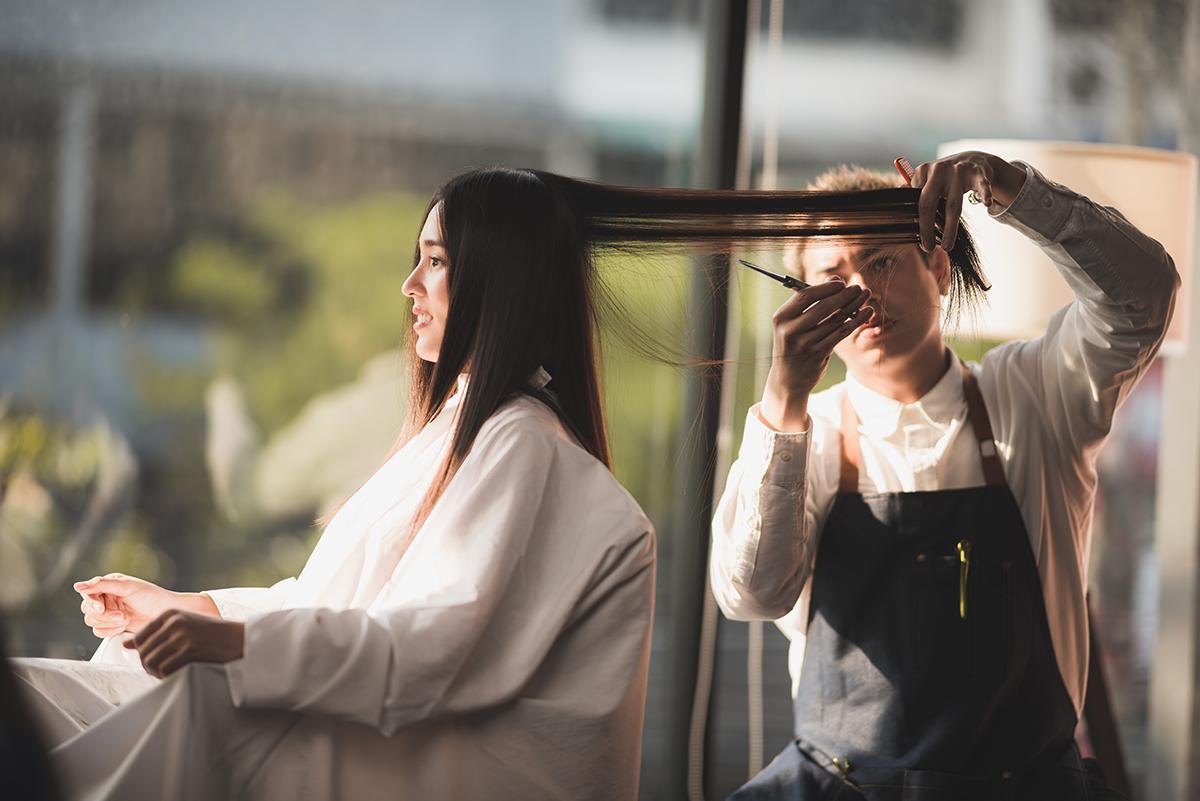 Asian woman at the salon getting a haircut