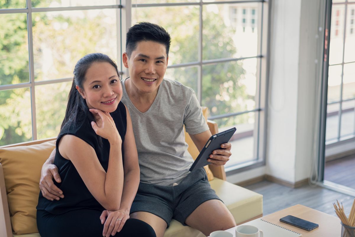 Asian couple sitting together
