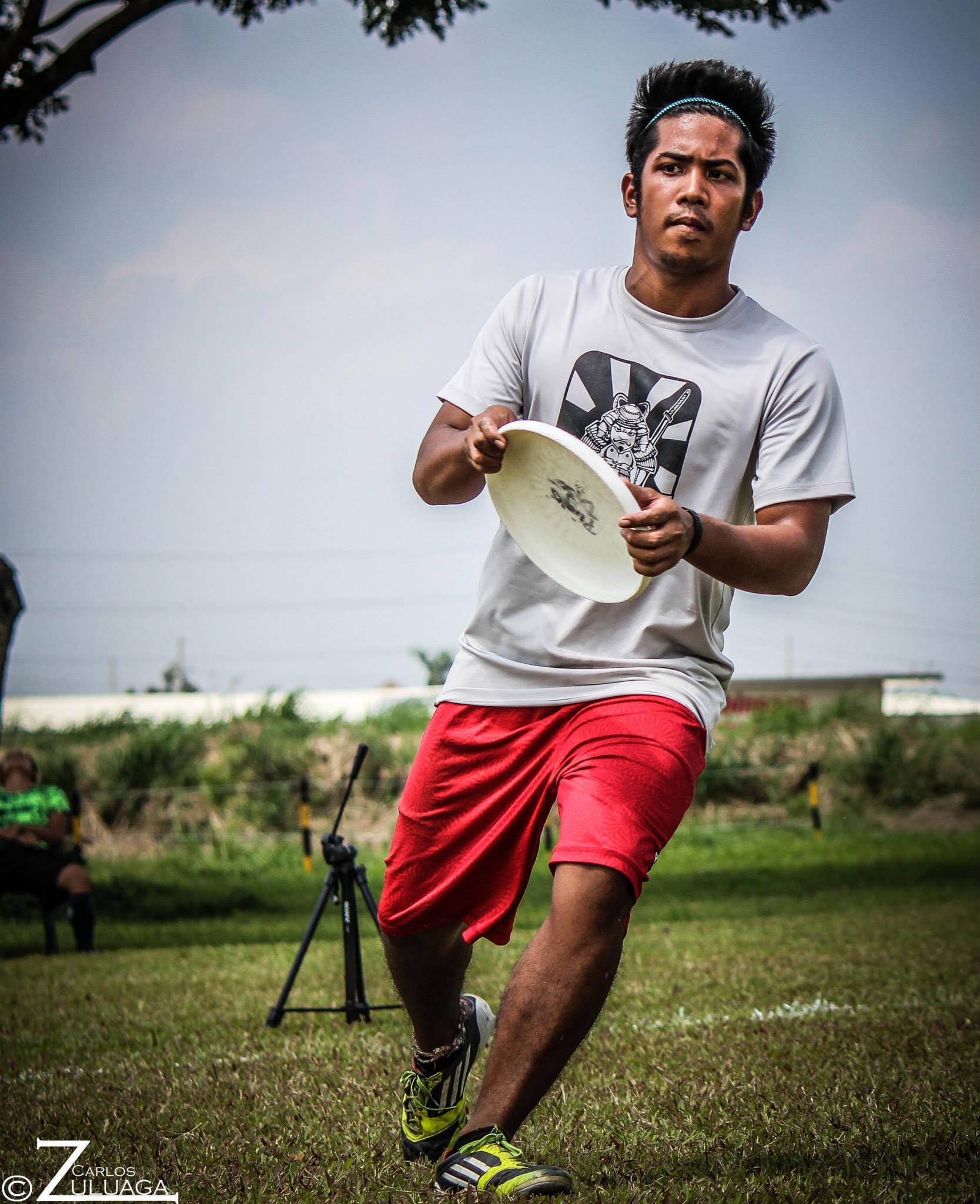 A man playing ultimate frisbee outdoor